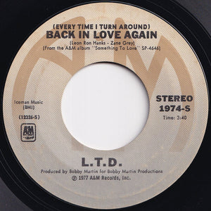 L.T.D. - (Every Time I Turn Around) Back In Love Again / Material Things (7 inch Record / Used)