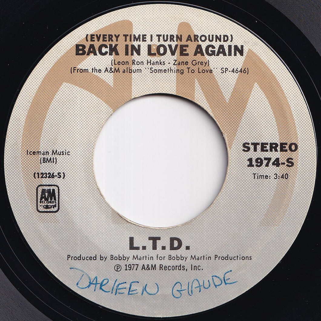 L.T.D. - (Every Time I Turn Around) Back In Love Again / Material Things (7 inch Record / Used)